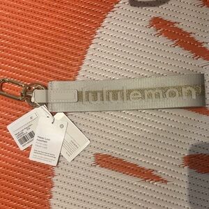 Lululemon Gray and Gold Keychain